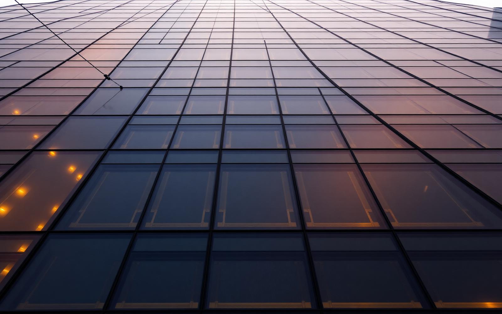 Navy glass facade of a bank tower